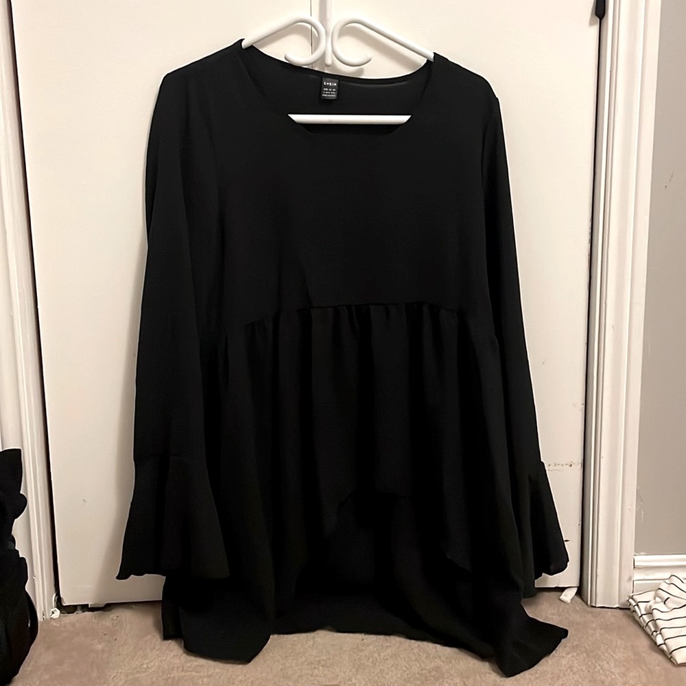 Black flowing blouse with flaired cuffs